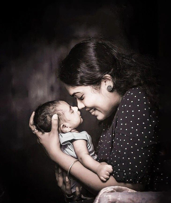 Mother looking down at her newborn baby